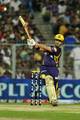 Kolkata Knight Riders batsman Gautam Gambhir (C) walks back after losing his wicket as his teammates applaud his innings of 93 runs during the IPL Twenty20 cricket match between Kolkata Knight Riders and Royal Challengers Bangalore at The Eden Gardens in Kolkata on April 28, 2012.