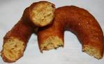 Two halves of homemade apple cider donuts