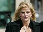 Anna Nicole Smith, front left, leaves the U.S. Supreme Court, Tuesday, Feb. 28, 2006, in Washington. With an oil fortune on the line, former stripper Anna Nicole Smith encountered a sympathetic audience at the Supreme Court on Tuesday. (AP Photo/Manuel B