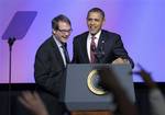 President Barack Obama talks with United Auto Workers president Bob King after arriving to speak at the UAW conference in Washington, Tuesday, Feb. 28, 2012. (AP Photo/Susan Walsh)