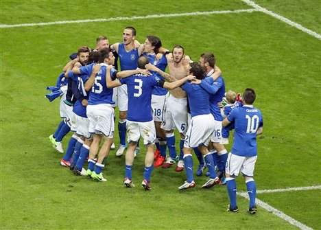 Italian players celebrate after winning the Euro 2012 soccer championship semifinal match between Germany and Italy in Warsaw, Poland, Thursday, June 28, 2012.