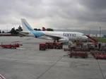 TAME aircraft at Bogotá in 2010, with the new design and logo of TAME colors are blue, light blue and gold, which is a decorative element.