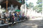 Tibetans offering barley powders during the annual incense burning festival in Dharamshala, India