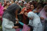 Kashmiri Muslim relatives of ruling party National Conference Block President Abdul Rehman Ganaie mourn during his funeral in Srinagar on June 15,2012. Suspected Muslim rebels gunned down Ganaie in the latest string of alleged political killings in Kashmir. Ganaie was shot at close range by suspected rebels as he was leaving his home to offer Friday prayers at a local mosque,police said