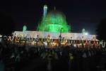 Kashmiri Muslim devotees participate in night prayers at the Hazratbal shrine on the shore of Dal Lake in Srinagar on July 17, 2012. Thousands of Kashmiri Muslims celebrated Mehraj-u-Alam, the Night Ascension of the Prophet Muhammad on his historical night journey from the Grand Mosque of Kaaba to the Mosque Aqsa in Jerusalem and onward to the seven skies.