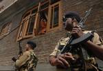 Indian paramilitary troops keep vigil After in Srinagar on June 15,2012. Suspected Muslim rebels gunned down Ganaie in the latest string of alleged political killings in Kashmir. Ganaie was shot at close range by suspected rebels as he was leaving his home to offer Friday prayers at a local mosque,police said.