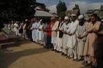 Kashmiri Muslims offer prayers to ruling party National Conference Block President Abdul Rehman Ganaie during his funeral in Srinagar on June 15,2012. Suspected Muslim rebels gunned down Ganaie in the latest string of alleged political killings in Kashmir. Ganaie was shot at close range by suspected rebels as he was leaving his home to offer Friday prayers at a local mosque,police said.