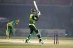 Pakistani batsman Sohail Tanvir, right, looks back as he is bowled by South African pacer Charl Langeveldt, left, during the first one-day international cricket match between Pakistan and South Africa at Gaddafi Stadium in Lahore, Pakistan on Thursday, Oct. 18, 2007.