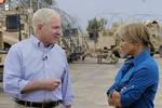 U.S. Defense Secretary Robert M. Gates talks with 60 Minutes Anchor Katie Couric during an interview for her show in Mosul, Iraq, Apr. 8, 2011. Secretary Gates met with the U.S. and Iraqi leaders, troops and held discussions while taking photos and giving out coins to deployed members during his stay in Iraq. DoD photo by Master Sgt. Jerry Morrison(RELEASED)