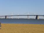 Chesapeake Bay Bridge from Sandy Point State Park. Traffic patterns on the bridge's five lanes can be adjusted via its lane control system, which consists of overhead lane control signals on both spans and approaches.