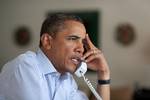 President Barack Obama holds conference call on Hurricane Irene with FEMA Director Craig Fugate, Homeland Security Secretary Janet Napolitano, Chief of Staff Bill Daley, and John Brennan, Assistant to the President for Homeland Security, in Chilmark, Massachusetts, August 25, 2011.