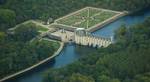 Château de Chenonceau and its gardens. The original manor was torched in 1412 to punish owner Jean Marques for an act of sedition. He rebuilt a castle and fortified mill on the site in the 1430s.