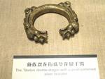 Tibetan silver bracelet, double-dragon-with-pearl pattern Jewelry in the Yunnan Nationalities Museum, Kunming, Yunnan, China.