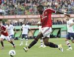 AC Milan midfielder Sulley Muntari, of Ghana, kicks the ball during the Serie A soccer match between AC Milan and Genoa at the San Siro stadium in Milan, Italy, Wednesday, April 25, 2012.