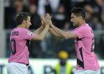 Juventus's Marco Borriello, right, celebrates with his teammate Alessandro Del Piero after scoring a goal during their Serie A soccer match against Cesena, at Cesena's Manuzzi stadium, Italy, Wednesday, April 25, 2012.