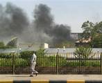 Black smoke is seen coming from the intelligence services building that came under attack in the southern port city of Aden, about 200 miles (320 kilometers) south of the capital, San'a, in Yemen Saturday, June 19, 2010, al-Qaida are believed responsible.