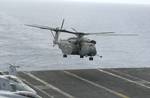 An MH-53E Sea Dragon assigned to the Blackhawks of Helicopter Mine-Counter-Measures Squadron 15 (HM-15) lands aboard USS Nimitz (CVN 68)