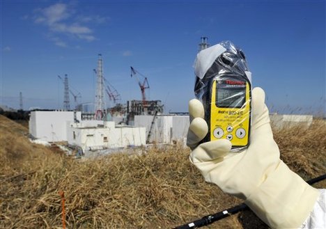 A radiation monitor indicates 131.00 mSv per hour near Unit 3 and 4 reactor buildings at Tokyo Electric Power Co.,'s tsunami-crippled Fukushima Dai-ichi nuclear power station in Okuma, Fukushima prefecture, northeastern Japan, Tuesday, Feb. 28, 2012.