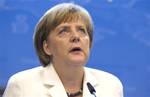 German Chancellor Angela Merkel speaks during a media conference at an EU Summit in Brussels on Friday, June 29, 2012.