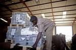 A southern Sudanese man stores referendum material, in Juba, southern Sudan on Wednesday, Dec. 22, 2010. More than 7.3 million ballots have arrived in Southern Sudan for an independence referendum that is likely to create the world's newest country. U.N. official Denis Kadima said a chartered plane delivered the ballots Wednesday from England, where they were printed. The charter helped the U.N. avoid Europe's flight delays.