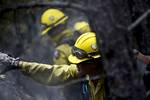 Vandenberg Air Force Base Hot Shot fire fighter Marissa Halbeisen helps cut and clear a fire line on June 28, 2012 in the Mount Saint Francois area of Colorado Springs, Co. while helping to battle several fires in Waldo Canyon. The Waldo Canyon fire has grown to 18,500 acres and burned over 300 homes. Currently, more than 90 firefighters from the Academy, along with assets from Air Force Space Command; F.E. Warren Air Force Base, Wyo.; Fort Carson, Colo.; and the local community continue to figh