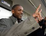 Actor Will Smith gives the victory sign to reporters upon his arrival at Ciampino airport in Rome, Friday, Nov. 17, 2006. Smith is in Rome to attend the expected wedding of actors Tom Cruise and Katie Holmes, likely to take place at a medieval lakeside town Bracciano, outside Rome, on Saturday.