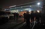 Ambulance vehicles and emergency workers are seen in front of Domodedovo airport in Moscow, Monday, Jan. 24, 2011. An explosion ripped through the international arrivals hall at Moscow's busiest airport on Monday, killing dozens of people and wounding scores, officials said. The Russian president called it a terror attack.