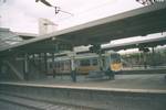 A Connex South Central British Rail Class 319 EMU rips through Bletchley station in 2000.