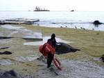 JUNEAU, Alaska (Jan. 6, 2005) - Soybean-filled waves continue to crash the shoreline Wednesday along Unalaska Island weeks after the Selendang Ayu grounded, breaking in two and spilling its cargo in the Bering Sea. (Official Unified Command photo) (99189) ( SELENDANG AYU (FOR RELEASE) )