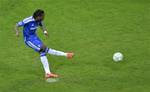 Chelsea's Didier Drogba scores the decisive shootout penalty during the Champions League final soccer match between Bayern Munich and Chelsea in Munich, Germany