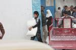 Palestinians receive their monthly food aid at a UN distribution center in the Shati refugee camp,January 17, 2012, in Gaza City. The UN Agency for Palestinian Refugees (UNRWA) in Gaza launched an appeal for emergency funds to the Palestinian territories of $ 300 million (235 million), The Deputy Chief Commissioner Margo Ellis at the third anniversary of the end of the devastating Israeli operation 