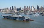 USS Iwo Jima (LHD-7) pulls into Pier 88 after sailing up the Hudson River to kick off Fleet Week 2002 in New York City, 22 May 2002