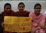 A group of Kashmiri students hold candles as they stage a symbolic protest against corruption on the banks of Dal Lake in Srinagar, the summer capital of Indian Kashmir, 15 May 2012. Protesters comprised of students from medicine, journalism, law and social science. Corruption in India has been at the forefront of the debate as the parliament in last session tried to pass an anti-corruption bill, but failed to pass it as the legislators couldn't develop a consensus over the issue.