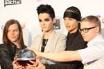 Tokio Hotel at the award ceremony of the comet on 21 May 2010 in Oberhausen. From left to right: Georg Listing, Bill and Tom Kaulitz, Gustav damage