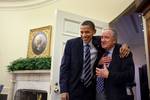 The day after the health care bill passed, President Barack Obama greeted Senator Tom Harkin at the door of the Oval Office before a meeting with the Senate Democratic Leadership.