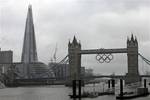 A view of the iconic Tower Bridge, right, over the river Thames, right, and The Shard, left, a newly-constructed high-rise building that is western Europe’s tallest, in London,Wednesday, July 4, 2012 ahead of the official Inauguration on Thursday, July 5, 2012. The Shard is 309.6 meters tall (1,016 feet) and features high quality offices, a 5-star hotel with more than 200 rooms and suites and 3 floors of restaurants. It will also feature exclusive super prime residential apartments and the top l