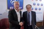 New coach of France's national football team, Didier Deschamps, left, shakes hand with the President of the French soccer Federation (FFF) Noel Le Graet, right, at the end of a press conference, at the French football federation headquarters, in Paris, Monday July 9, 2012. The French Football Federation announced the appointment on its Web site on Sunday after Laurent Blanc turned down a new contract offer last month.