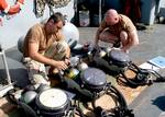 The Arabian Gulf (Apr. 2, 2003) – Aircrew Survival Equipment man 1st Class Matthew Harrison and Boatswain’s Mate 2nd Class Glenn Landers assigned to Explosive Ordnance disposal Mobile Unit(EODMU) 2 Det. 5 conduct checks on their equipment before beginning their diving operations in the Arabian Gulf.