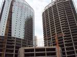 A building project in Wuhan China, the difference in progress between the two towers illustrates the relationship between the inner load bearing structure and the exterior glass curtain.