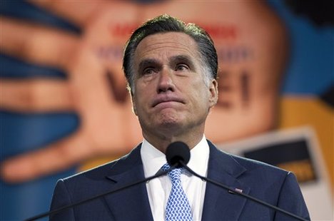 Republican presidential candidate, former Massachusetts Gov. Mitt Romney pauses during a speech to the NAACP annual convention, Wednesday, July 11, 2012, in Houston, Texas.