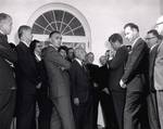 President John F. Kennedy greets members of the President's Panel on Mental Retardation in the White House Rose Garden on October 18, 1961. Kennedy's family was personally affected by the mental retardation of one of his sisters and the President sought to foster into the causes of the condition. Lederberg, who had advised Kennedy on health matters as a member of his transition team, began investigations into the genetics of mental retardation not long after his arrival at Stanford University in