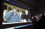 ordon Oldham, senior partner at the Oldham, Li & Nie law firm, right, shows his video on the conversation with Hong Kong casino tycoon Stanley Ho held on Jan. 25, during a news conference in Hong Kong, Monday, Jan. 31, 2011. Family members involved in a dispute with ailing casino baron Stanley Ho over ownership of his gambling empire said he has dropped his lawsuit against them, but a law firm representing the billionaire denied it Monday. It's yet another twist in a family feud that erupted las