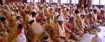 Brides and grooms sit during a mass marriage ceremony on 123 Couples who will be tying the knot out on 1st July 2012 at Haldiram Banquets organisational by Vishwa Jagriti Mission Trust in Kolkata on Sunday 1st July 2012