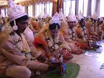 Brides and grooms sit during a mass marriage ceremony on 123 Couples who will be tying the knot out on 1st July 2012 at Haldiram Banquets organisational by Vishwa Jagriti Mission Trust in Kolkata on Sunday 1st July 2012