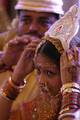 Brides and grooms sit during a mass marriage ceremony on 123 Couples who will be tying the knot out on 1st July 2012 at Haldiram Banquets organisational by Vishwa Jagriti Mission Trust in Kolkata on Sunday 1st July 2012