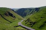 Winnats Pass is in the High Peak area of the English county of Derbyshire. It lies to the west of the village of Castleton, in the National Trust's High Peak Estate. The road winds through a cleft, surrounded by towering limestone pinnacles.