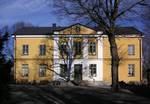 The main building of Skarpnäcks gård, as constructed in the 1860s. According to a document from 1432, Skarpa was sold by the Archdiocese of Uppsala to Hans Kröpelin, the chieftain of Eric of Pomerania, who was the King of Sweden at the time.