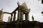 A Cambodian temple security guard stands at Preah Vihear temple, in Preah Vihear province, about 245 kilometers (152 miles) north of Phnom Penh, Cambodia, Wednesday, July 18, 2012.