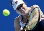 Russia's Alisa Kleybanova makes a backhand return to Romania's Simona Halep during their second round match at the Australian Open tennis championships in Melbourne, Australia, Thursday, Jan. 20, 2011.