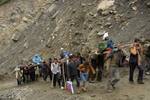 Hindu pilgrims travelling either on ponies or on foot, to the holy Amarnath Cave Shrine, in Baltal 110 KMS from Srinagar on July 01, 2012.over 1.60 Pilgrims had darshan of naturally formed ice lingam at the cave till date Every year, hundreds of thousands of pilgrims trek through treacherous mountains in revolt-torn Kashmir, along icy streams, glacier-fed lakes and frozen passes, to reach the Amarnath cave, located at an altitude of 3,857 meters (12,729 feet), where a Shiva Lingam, an ice stalag